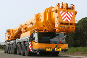 Yellow mobile crane for Jefferson Machine crane-parts support